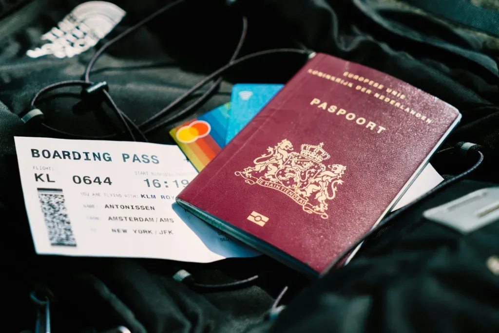 Indian passport and boarding pass laid out as part of a pre-departure checklist for Indian students