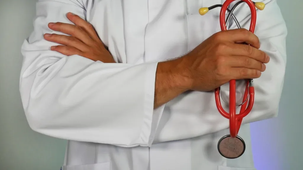 Doctor holding a stethoscope, representing a pre-departure health checkup for Indian students