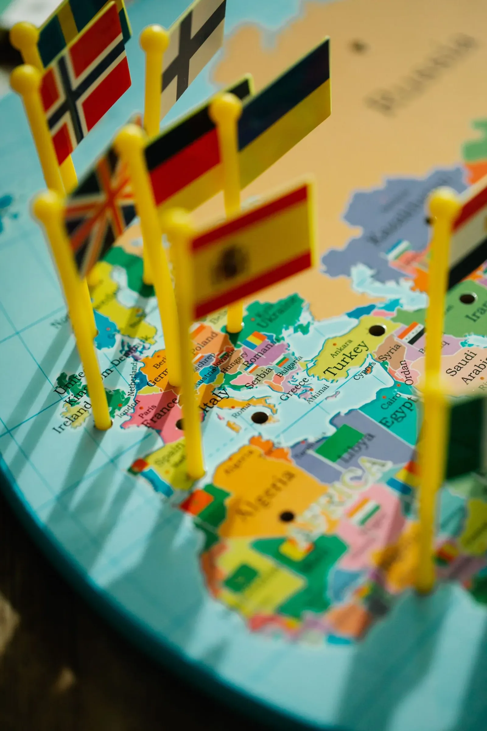 World map with country flags representing study abroad destinations