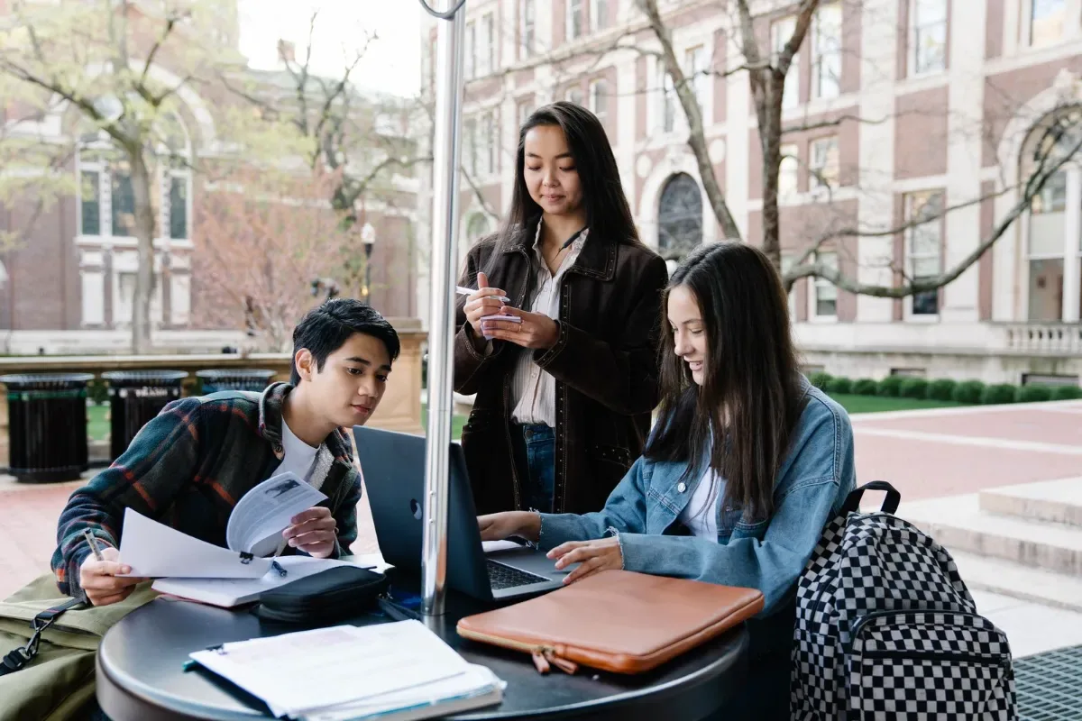 University students outside a modern campus building, University College Dublin